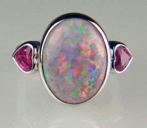 Black opal and pink sapphire heart ring in platinum