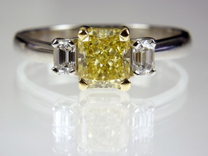 Yellow Diamond Ring in Platinum - Yellow Diamond Ring 1.22ct fancy intense yellow radiant cut diamond (GIA certificated) set with 30 points of emerald cut diamond in platinum.
