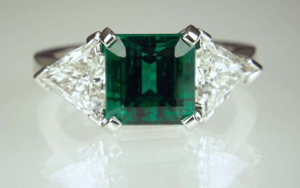 Emerald & diamond ring - 2.41ct emerald from Zambia.  Certified untreated - no clarity enhancement. Set with 1.26ct matched pair of E colour VS1 clarity trillion cut diamonds. Ring handmade in platinum.
