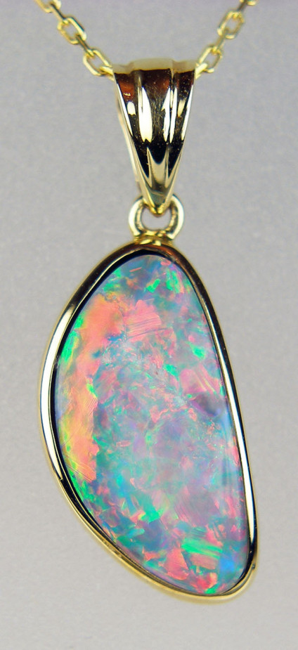 Opal doublet pendant in 14ct yellow gold - 3.80ct opal doublet set in 14ct yellow gold. Chain to suit available separately. Pendant measures 25 x 9mm.