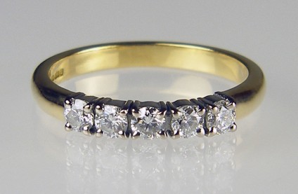 5 stone 1/2ct diamond ring - 5 stone diamond ring in 18ct white and yellow gold set with 5 x 0.10ct round brilliant cut diamonds in F colour VS clarity. This item is second hand, having been made by Just Gems for a customer who later replaced it with a larger model.