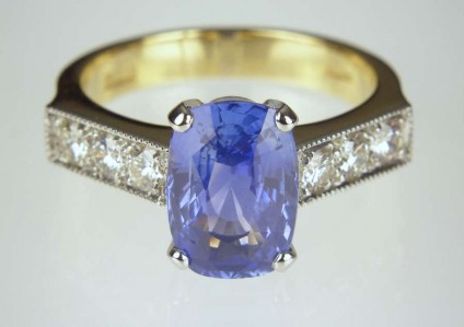 Sapphire & diamond ring - 3.67ct cushion cut hyacinth blue sapphire from Sri Lanka, set with 0.5ct round brilliant cut diamonds in 18ct yellow gold & platinum