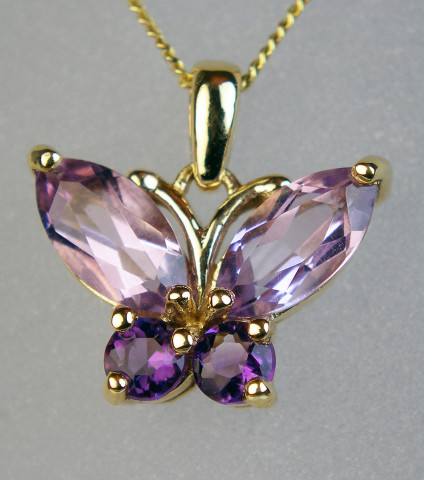 Amethyst butterfly pendant in 9ct - Butterfly pendant set with pretty faceted amethyst gemstones and suspended from an 18ct 9ct yellow gold chain