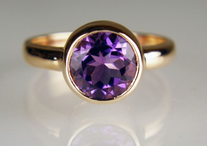 Amethyst ring in 18ct rose gold - 8mm round amethyst weighing 1.87ct rubover set in 18ct rose gold ring