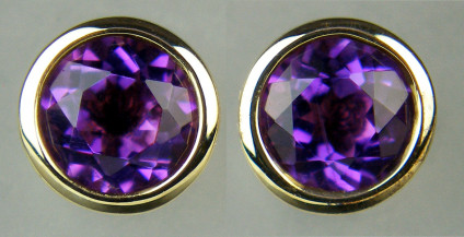 6mm round amethyst rounds rubover set in 9ct yellow gold earstuds - 0.95ct pair of amethyst rounds rubover set in 9ct yellow gold. Earstuds are 6.3mm.