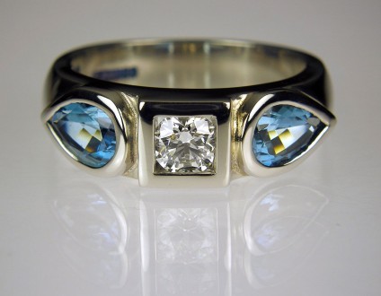 Diamond & Aquamarine ring in Palladium - Diamond & aquamarine ring in palladium.  Set with 0.34ct E/SI1 GIA certificated diamond & 1.36ct pear cut aquamarines from Mozambique. Band 6mm wide.
