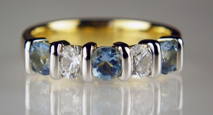 Aquamarine & diamond ring - 4mm round aquamarines & diamonds set in 18ct yellow gold ring with platinum veneers. Total diamond weight 0.47ct, aquamarine weight 0.67ct. Diamond grade F/VS.