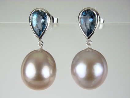 Aquamarine & Pearl Earrings - Aquamarine & cultured pearl earrings in 18ct white gold. 1.65ct aquamarine pears with lilac grey natural coloured pearls in 18ct white gold.
