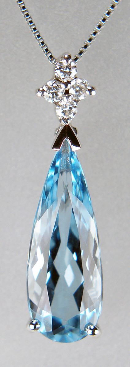 Aquamarine & diamond pendant in 18ct white gold - Skinny pear shaped aquamarine, very sparkling stone, set with 0.08ct round brilliant cut diamonds in dainty 14ct white gold pendant, suspended from fine box style chain. Pendant is 23mm long.