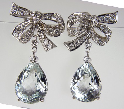 Aquamarine & Diamond Bow Earrings - Aquamarine bow earrings set with 9.17ct aquamarine briolettes & 0.64ct diamonds in 18ct white gold.
