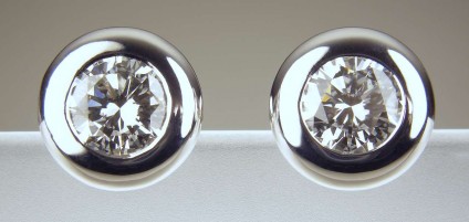 Diamond Earrings - Round brilliant cut certified diamonds (G/H colour SI clarity) totalling 1.41ct in 18ct white gold rubover setting.