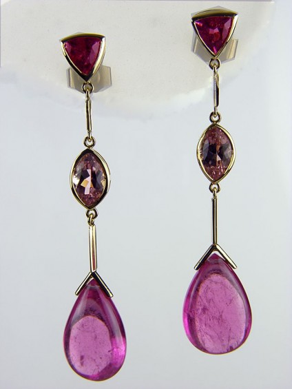 Tourmaline Earrings in 18ct Yellow Gold - Pink tourmaline drop earrings set with two pairs of faceted pink tourmalines of 1.17ct & 1.7ct respectively, with a matched pair of 18.29ct cabochon briolette pink tourmalines all mounted in 18ct yellow gold.
