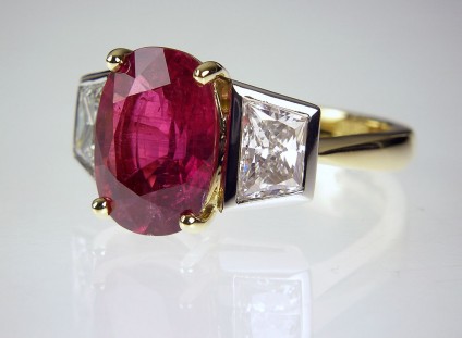 Ruby & Diamond Ring - Ruby & diamond ring - 4.12ct natural, untreated (SSEF certificate confirming there is no evidence of heat treatment or clarity enhancement) ruby 4.12ct, set with a matched pair of trapeze cut diamonds totalling 1.49ct, in platinum and 18ct yellow gold.
