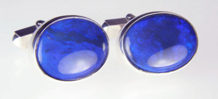 Black opal cufflinks - Beautiful luminous blue oval black opals set in silver as cufflinks. These smart and unique cufflinks are included in our 20 year anniversary sale and now costs £725.