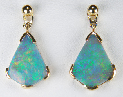 Black opal eardrops in 18ct yellow gold - 4.10ct kite cut pair of Australian solid black opals claw set in 18ct yellow gold as detachable eardrops. In this photo they are suspended from simple ball and post earstuds in 18ct yellow gold. Studs are £140. We also think they look spectacular with our mandarin garnet, blue sapphire and green tsavorite studs, not to mention suspended from diamond or pearl studs. There are many and varied possibilites with these stunning drops.