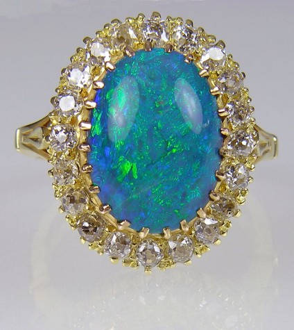 Antique Opal & Diamond Ring - Victorian ring of 4.77ct black opal and old cut diamonds set in 18 carat yellow gold. 20 x 16mm. Independent valuation for insurance is included with this piece.
