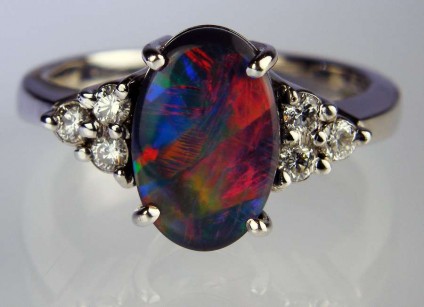 Black opal & diamond ring - 11 x 7mm solid black opal set with 0.24ct G colour VS clarity diamonds in 9ct white gold