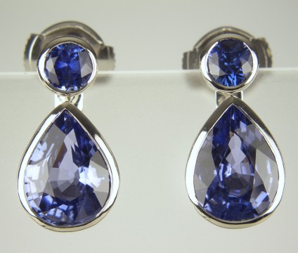 Sapphire Earrings with detachable drops - Round brilliant cut blue sapphires totalling 0.49ct with detachable pear cut sapphire drops of 3.60ct, all bezel set in 18ct white gold.