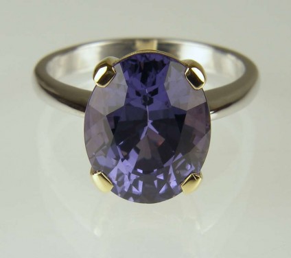 Blue spinel ring - 5.97ct oval blue/lilac blue colour change spinel, with independent report confirming wholly untreated, set in 18ct yellow gold claws on 18ct white gold shank
