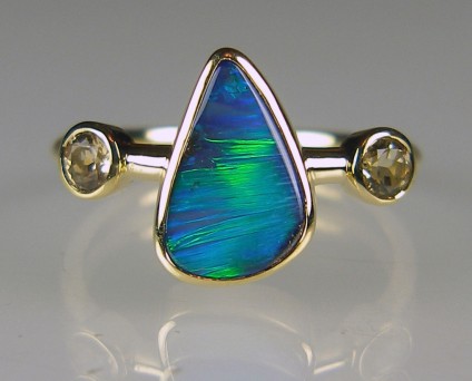 Boulder opal & precious topaz ring - Vivid blue/green boulder opal 1.90ct from Queensland, Australia, set with 2 x 3.5mm round precious (golden) topaz in 18ct yellow gold
