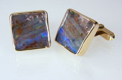 Boulder Opal Cufflinks  - Boulder opal cufflinks in 9ct yellow gold. 17mm square.
