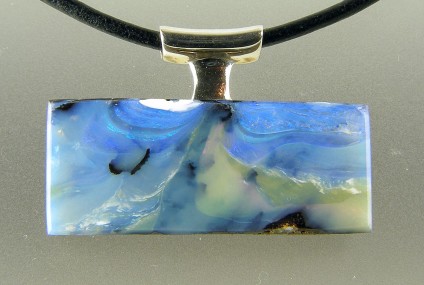 Boulder opal pendant in silver  - Boulder opal pendant in silver on leather cable. 33 x 22mm.
