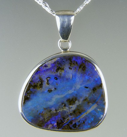 Boulder opal pendant in silver - Boulder opal pendant in silver on silver chain. 30 x 40mm.

