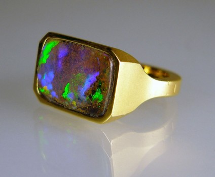 Boulder opal ring in 14ct yellow gold opening shank - 8.33ct vibrant purple green boulder opal rubover set in satinised finish 14ct yellow gold mount.  The mount incorporates the special SUPERFIT opening shank for a customer with slim fingers and larger knuckles.