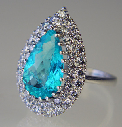 Paraiba tourmaline & diamond ring - Pear cut tourmaline from Paraiba, Brazil, weighing 3.78ct set with 1.57ct diamonds in E colour VS clarity and mounted in an 18ct white gold setting.