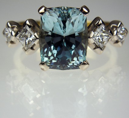 Aquamarine & Diamond Ring in 18ct Gold - 4 carat antique cut African aquamarine (unheated), flanked by two matching pairs of princess cut white diamonds totalling 0.6carats in weight.  