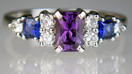 Blue & purple sapphire ring with diamonds - One of our successful remodelling jobs!  We took the diamonds from our client's worn-thin eternity ring and reset them with 0.34ct of blue and 0.71ct of purple sapphires in 18ct white gold. A lovely result.