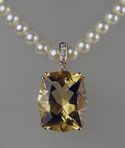 Citrine, diamond and pearl necklace in yellow gold - 27.53ct fancy cut citrine, set with diamonds in 9ct yellow gold as a pearl enhancer pendant suspended from delicate cultured pearl necklace.