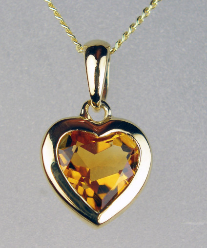 Citrine heart pendant in 9ct yellow gold - Pretty heart cut citrine eighing 0.98ct, rubover set in 9ct yellow gold and suspended from an 18" 9ct gold chain