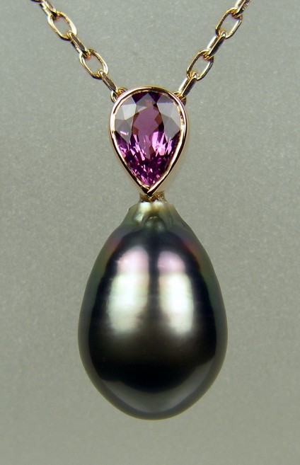 Purple sapphire & Tahitian pearl pendant in rose gold - 0.92ct pear cut  purple sapphire set with a dark Tahitian drop shaped pearl with purple overtones in 18ct rose gold and suspended from an 18ct rose gold chain 16-18" adjustable.  The pendant is 24mm long.