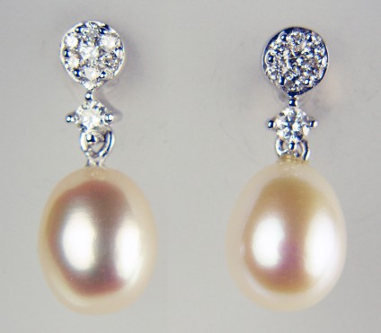 Delicate pearl drop and diamond earrings in 9ct white gold - 18pt of diamonds mounted with delicate pinkish-white cultured pearls 9 x 7mm make a beautiful combination set in 9ct white gold in these beautiful earrings measuring a total length of 18mm 