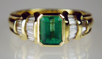 Emerald and diamond baguette ring - 1.09ct emerald cut Colombian emerald set with 0.49ct of baguette cut diamonds in 14ct yellow gold