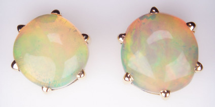 Ethiopain opal earstuds in 18ct yellow gold - 3.67ct roundish Ethiopian opals claw set in 18ct yellow gold earstuds. Our Ethiopian opals are wholly untreated. Opals are approximately 9mm round.