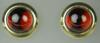 Round garnet cabochon earstuds in 9ct yellow gold - 2.25ct pair of round cabochon red garnets rubover set in 9ct yellow gold earstuds. Earstuds are 8.8mm in diameter 