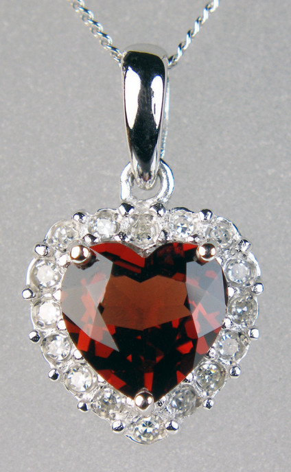 Lovely garnet heart cut pendant with diamond halo in 9ct white gold - Lovely red garnet heart cut surrounded by round brilliant cut diamonds in 9ct white gold and suspended from an 18" 9ct white gold chain