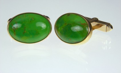 Gaspeite cufflinks in gold - Gaspeite cufflinks in 9ct yellow gold. 19 x 14mm. Gaspeite is a rare nickel carbonate mineral.
