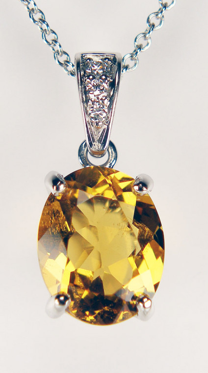 Golden beryl & diamond pendant in platinum - Delicate pendant set with a 2.17ct oval golden beryl (often erroneously called yellow emerald) - also known as heliodor, and 0.33ct f round brilliant cut diamonds in a platinum mount and suspended from an 18" fine trace chain in platinum. This pendant and chain are included in our 20 year anniverasry sale and are now priced at £442.50.