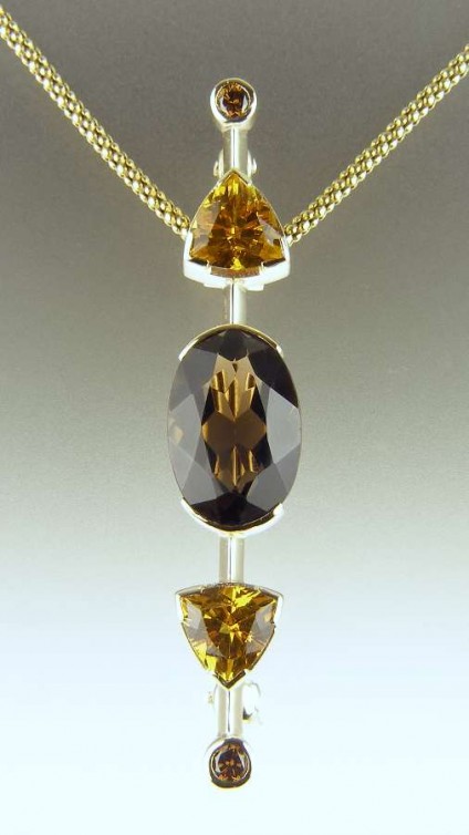 Smoky quartz, golden beryl & cinnamon diamond pendant - Oval smoky quartz (customer's own) set with 2.18ct golden beryl trillion cuts and a matched pair of cinnamon diamonds.  Mounted as a pendant - convertable to a brooch - in 9ct yellow gold.