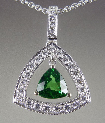 Tsavorite & diamond pendant - Tsavorite green garnet & diamond earrings. 0.87ct tsavorite trillion set with 0.35ct diamonds in 18ct white gold. 22x16mm.
