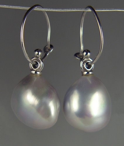 Grey pearl drop earrings - Grey pearl drop earrings in white gold. Pearls are freshwater cultured and 14mm wide by 16mm long. Hoops are in 18ct white gold. Total drop 35mm.
