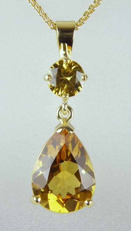Golden sapphire & beryl pendant in gold - 2.84ct pear cut golden beryl set with round brilliant cut golden sapphire 0.59ct in yellow gold.