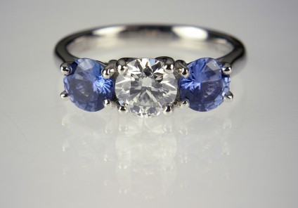 Diamond & sapphire ring in platinum - 70pt diamond round brilliant, GIA certificated in G colour/SI clarity/Excellent cut quality, set with a matched pair of round brilliant cut Sri Llankan sapphires 1.16ct in platinum 