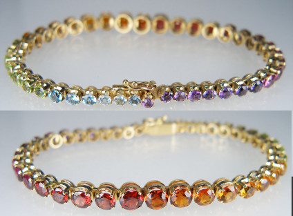 Multigem bracelet in 18ct yellow gold - Attractive and solidly made gemset bracelet with round cut gems in various varieties (amethyst, almandine garnet, pyrope garnet, citrine,peridot, and aquamarine), claw mounted in 18ct yellow gold. Bracelet is hallmarked in London 1983. This pre-loved bracelet is in excellent condition.The bracelet length is 7 1/2" and comes complete with a safety lock. The gems range from 5.5 -3mm in diameter. 