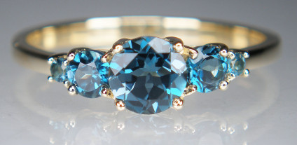 London blue topaz five stone ring in yellow gold - Pretty ring with five round brilliant cut London blue topaz gems, the central stone is 5.5mm in diameter