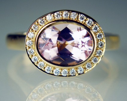 Morganite & diamond halo ring in 18ct rose gold - 1.54ct oval cut morganite set with 0.15ct round brilliant cut diamonds G colour VS clarity in 18ct rose gold ring