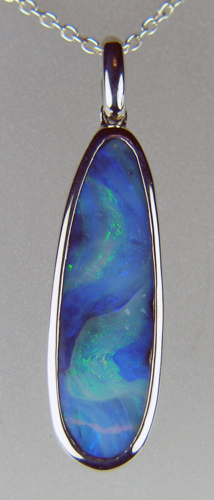 Boulder opal pendant in silver - Lovely pastel and intense blue boulder opal in silver pendant